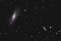 Messier 106 (left) with possible companion galaxy NGC 4217 (lower right)