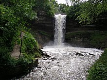 Minnehaha Falls surrounded by dark green summer foilage