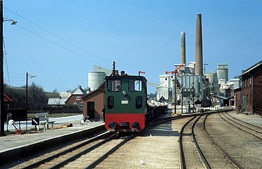 Faxe Railway from Faxe Kalkbrud (Limestone Quarry) to the harbor in Faxe Ladeplads, Limestone kilns in the front.