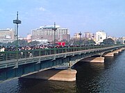 Crowds and police on the bridge during the 2011 Egyptian revolution