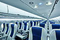 The cabin of a narrow-body airliner, with only 1 aisle