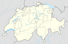 Mapa konturowa Szwajcarii, blisko centrum u góry znajduje się punkt z opisem „Zug”