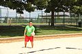 Addis serving in sand volleyball