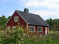 Röd stuga med vita knutar Red cottage, very common in Sweden