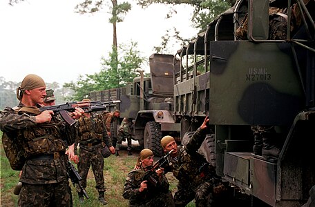 Ukrainian soldiers search Bulgarian Army trucks in Camp Lejeune during the Cooperative Osprey exercise in June 1998.