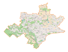 Mapa konturowa powiatu tomaszowskiego, blisko centrum na dole znajduje się punkt z opisem „Korhynie”