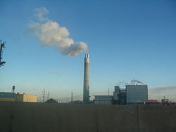 A smokestack releasing smoke