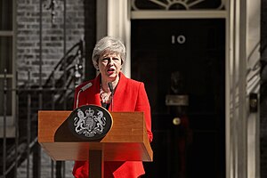 May outside 10 Downing Street, standing at a wooden lectern