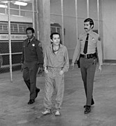 Charles Manson, escorted by two Los Angeles Sheriffs, 1973.jpg