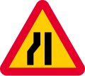 Road narrows on left sides