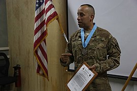 U.S. Army Staff Sgt. Renie Arana, with the 2nd Battalion, 7th Cavalry Regiment, 1st Cavalry Division, speaks after receiving an Audie Murphy Award at Bagram Airfield, Parwan province, Afghanistan, May 10, 2013 130510-A-XM609-048.jpg