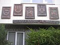 Insignia of twin towns on town hall in Kralupy nad Vltavou, Czech Republic