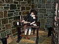 Waxwork of Bunyan in his prison cell