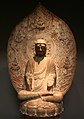 Photographie d'une statuette représentant un bouddha
