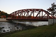 A small metal Parker truss bridge