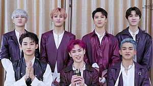 WayV in December 2019 From left to right, standing: Xiaojun, Yangyang, Ten, Hendery From left to right, sitting: Winwin, Kun, Lucas