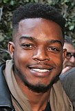 Stephan James posing for a photograph in 2017.
