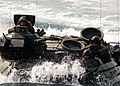 An amphibious assault vehicle assigned to the 26th Marine Expeditionary Unit maneuvers towards the amphibious dock landing ship USS Carter Hall (LSD 50).