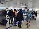 Passengers at Linate Airport in Milan have their temperatures taken