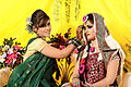 Image 29Relatives decorating the bride with traditional wedding turmeric in a Bangladeshi Gaye Holud ceremony in Dhaka. (from Culture of Bangladesh)