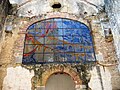 Stained glass panel above the main chapel entrance depicting Mount Carmel