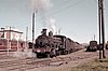 5616 stands at Junee ready to depart with a train of wheat hopper wagons.