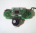 The circuit board and control stick housing removed from a controller