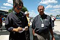 SPEED commentators Bob Varsha and David Hobbs in the plaza area