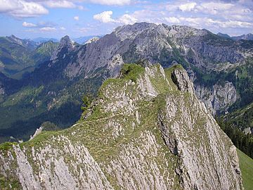 View from Branderschrofen (mountain top of Tegelberg) to Hochplatte, peak Geuselstone from far