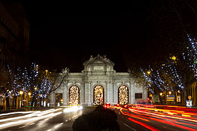 Puerta de Alcalá at night, at bottom El Retiro gardens.