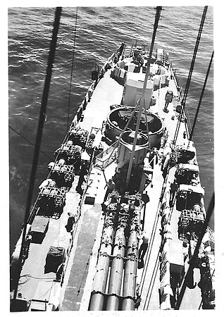 View aft from the mast of Rudderow-class USS Chaffee (DE-230) showing rear 5in and 40mm guns, depth charge racks, depth charge projectors and torpedo tubes.