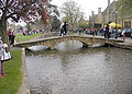 Pedestrian bridge over the River Windrush at Bourton-on-the-Water, Gloucestershire