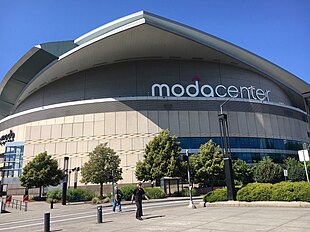 An exterior view of the Moda Center on a sunny day