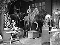 Super naturalistic Sculptor Rudolf Maison in his atelier in Munich with equestrian statue of Friedrich III