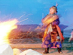 Tuvan shamaness Ai-Churek (Moon Heart) performing a fire rite in Kyzyl, Tuva.