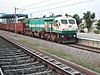 WDG-4 #12049, an EMD GT46MAC, leads empty BOXNs through Hi-Tec station