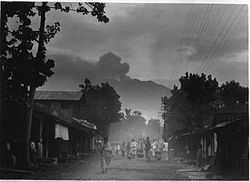 Glenmore in 1927. In the background is Mount Raung in activity.