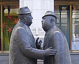 Statue of two men speaking