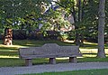 Parkanlage Lutherpark mit Wegeführung, historischem Baumbestand, Steinbank mit Inschrift, Luthereiche, Lutherstein und Gedenkstein für den Stadtbrand 1813