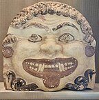 Fig. 17 Gorgoneion with earrings; terracotta antefix from the Acropolis of Athens, Acropolis Museum 78–87, K 292–29 (second half of the sixth century BC)[88]