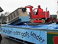 Rhyfälder Alemannisch aa de Fasnet. Ùffeme Waage stoot e Kommentar zum Abriss vùm alte Chraftwerch, wo dertemool bal het sölle stattfinde: „Ä Wunder - oder gots under“.