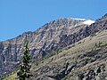 Summit of Rising Wolf Mountain at right background in Glacier National Park ‎ ‎