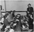 Brush-up classes to improve typing ability; group picture of women at typewriters in Illinois (National Youth Administration, 1937)