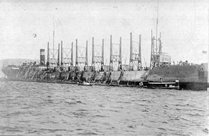 USS Nereus AC-10 loading coal at Nagasaki, Japan in April 1916.