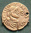 Mynt präglat under Childebert III:s tid med hans stiliserade bild på