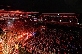 Crowd view from stage featuring carnival dancers on stage. The Awakening, LEEDS 2023.jpg