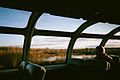 As seen from the dome car of the Canadian, a lake surrounded by fall colors and the prairies west of Edmonton, Alberta.