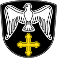 Gemeinde Reitenbuch In Schwarz über einem goldenen Kleeblattkreuz eine silberne Taube mit ausgebreiteten Flügeln.