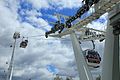 Image 6Gondolas of the Emirates Air Line cable car cross the River Thames from Greenwich Peninsula to Royal Docks.