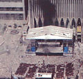 One of the last known photographs of the original memorial, seen below the Marriott Hotel on the left, during the September 11th attacks.